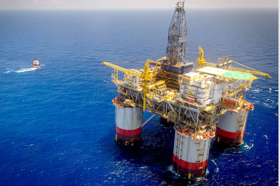 The Big Foot tension-leg platform on station in the Deepwater Gulf of America, with a supply vessel alongside.